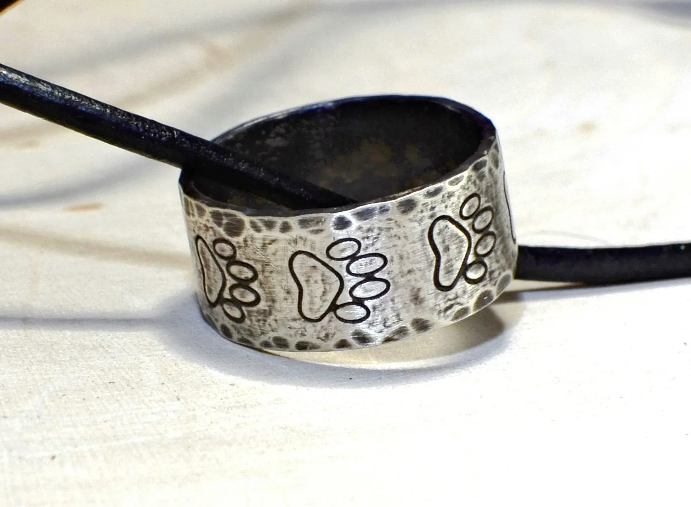 Hammered sterling silver paw ring necklace with rustic dark patina