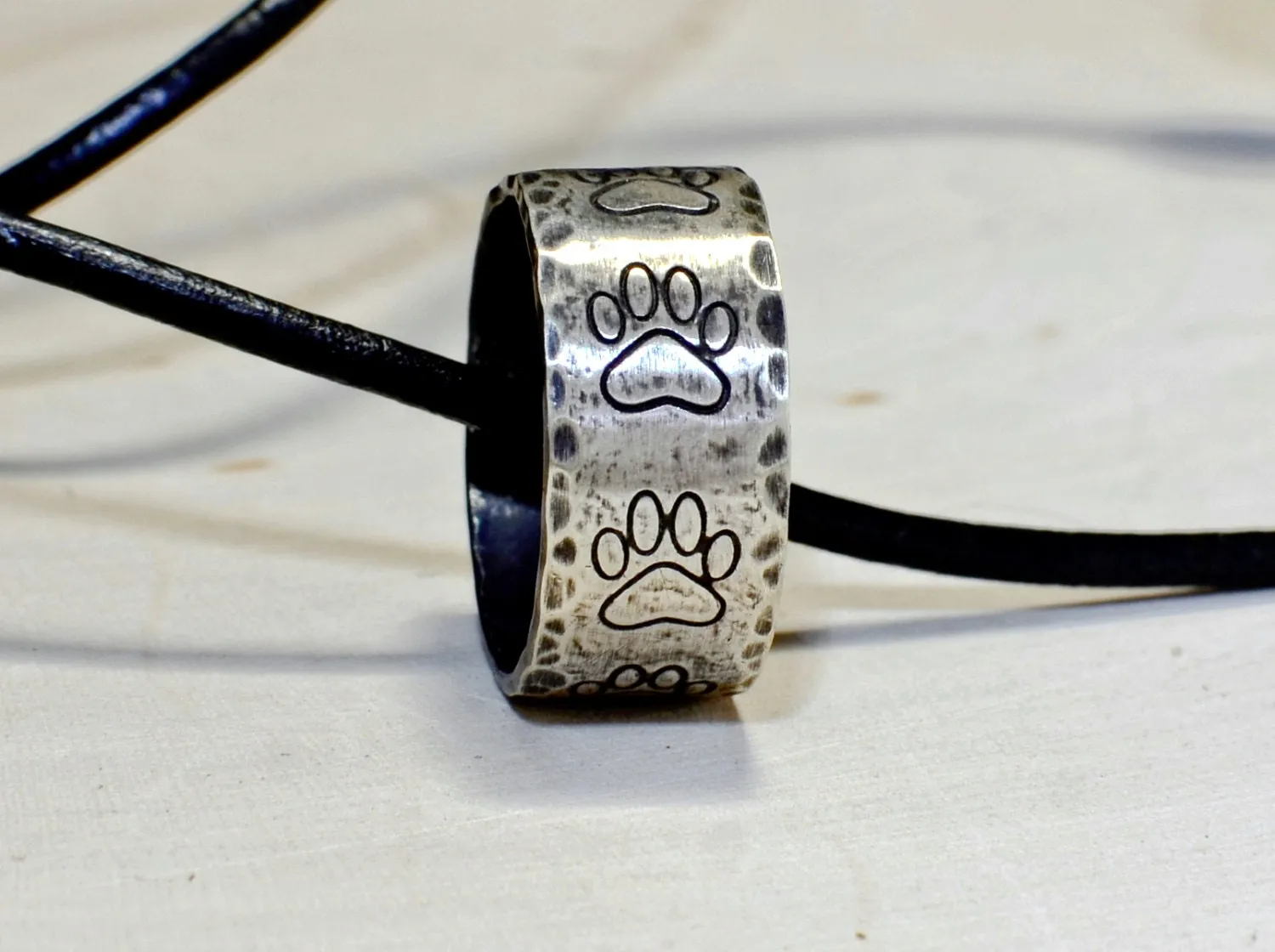 Hammered sterling silver paw ring necklace with rustic dark patina